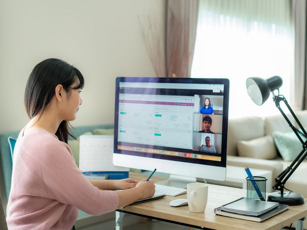 Asian business woman talking to her colleagues about plan in video conference multiethnic business team using computer for a online meeting in video call group of people smart working from home 2