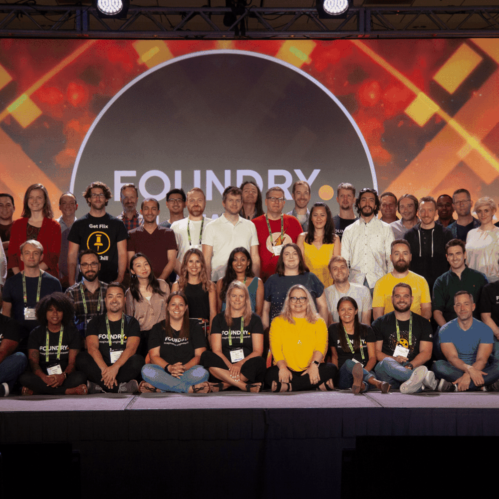 Group of Foundry employees standing on stage