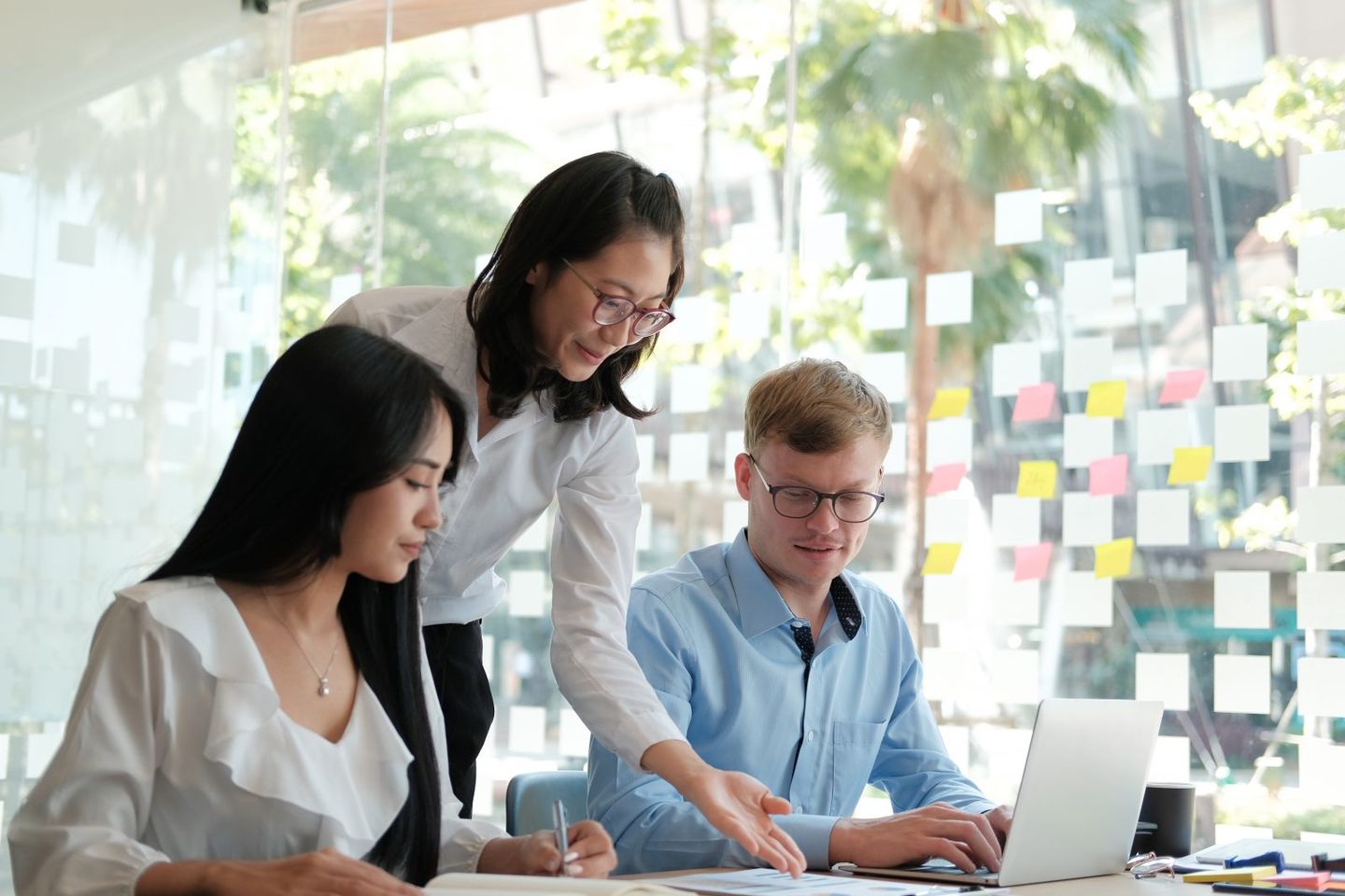 Business people discussing on performance revenue in meeting businessman working with businesswoman