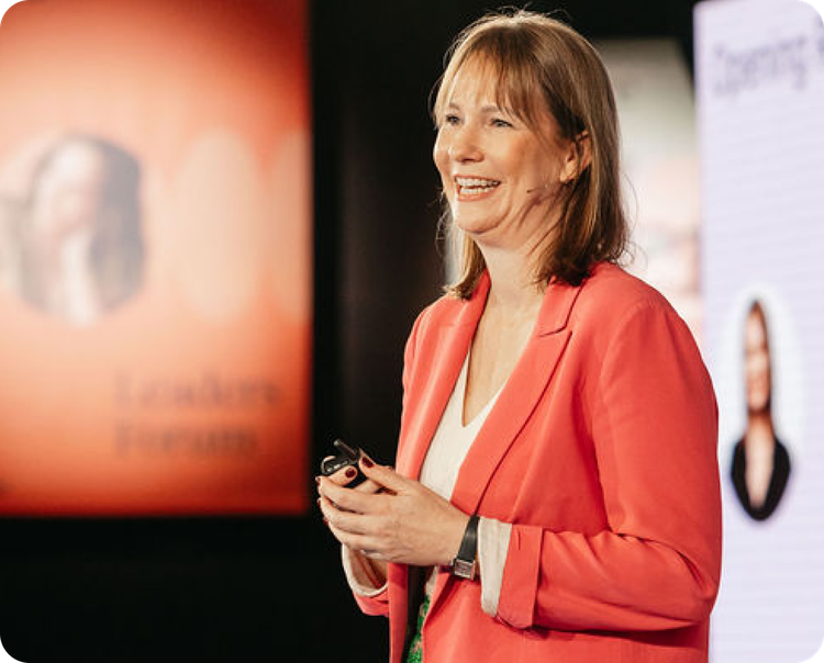 Culture Amp CEO Caro speaking at an event