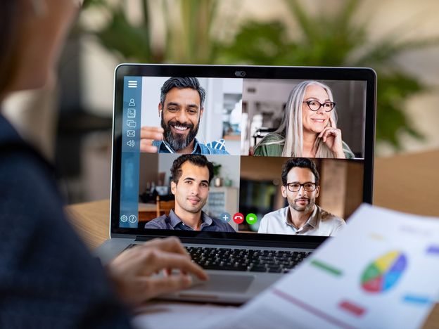 Woman working from home through video conference