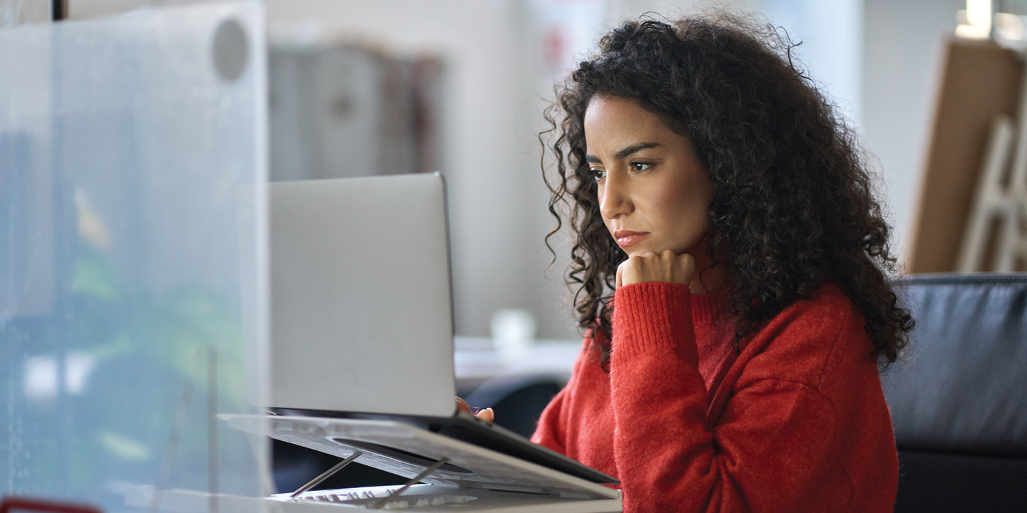 Woman looking at laptop