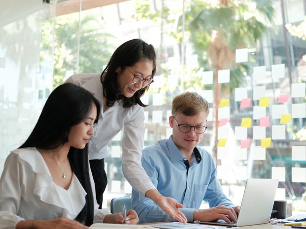 Business people discussing on performance revenue in meeting businessman working with businesswoman