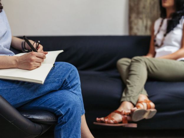 Psychotherapy session woman talking to his psychologist