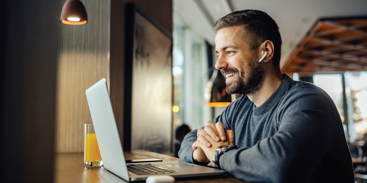 Person on laptop celebrating Employee Appreciation Day