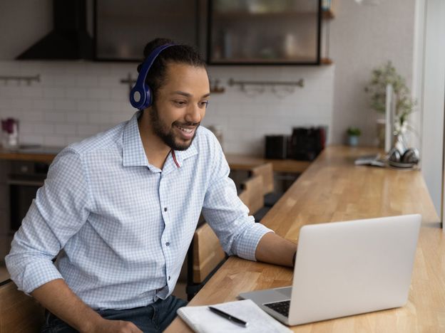 Black guy student in headphones get video consultation from tutor