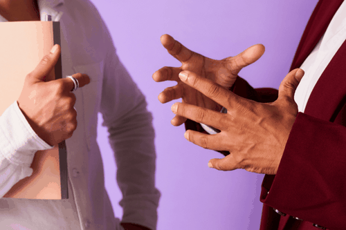 two people talking with hand gestures