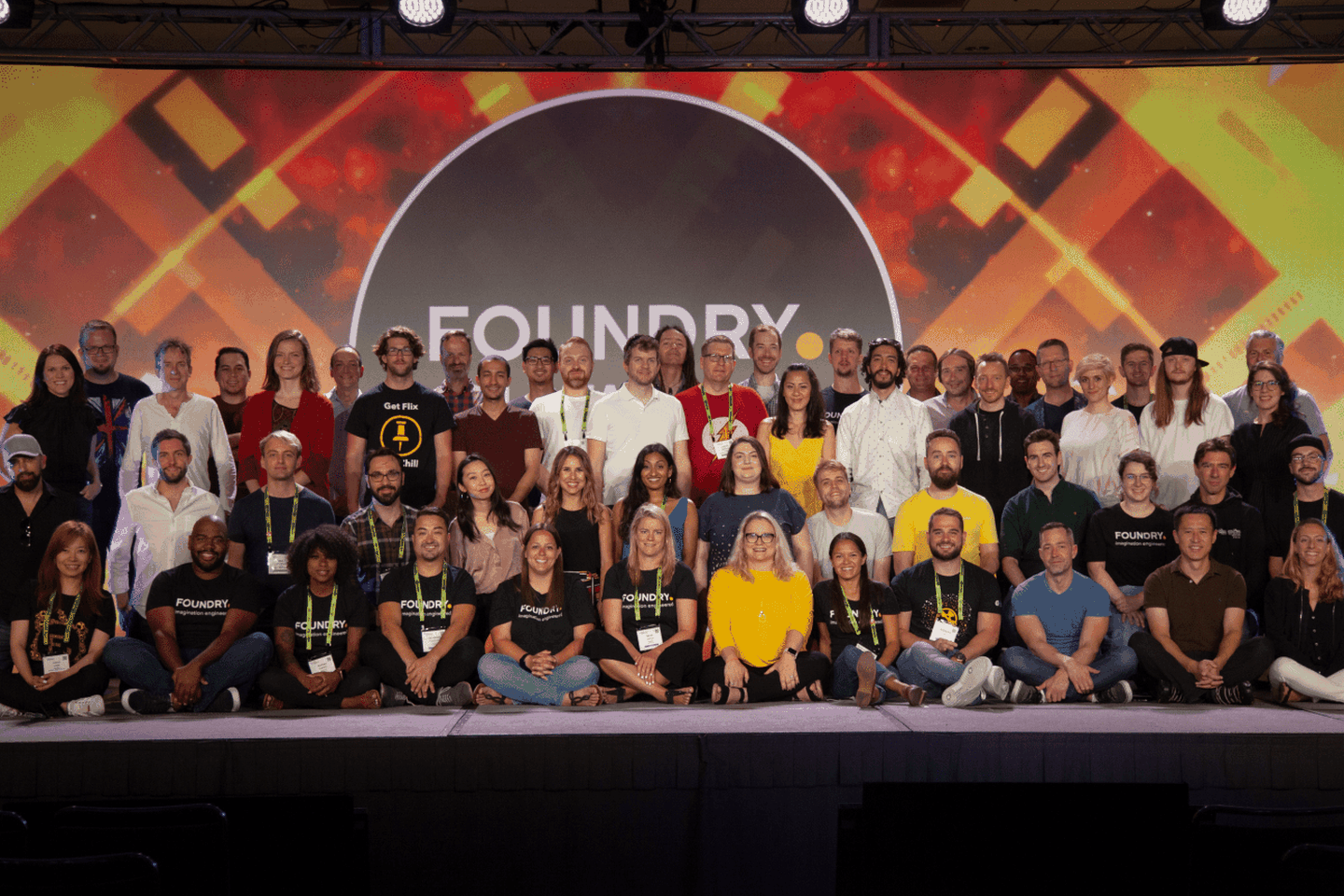 Group of Foundry employees standing on stage