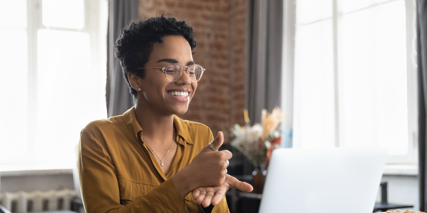 Woman doing sign language during a video call