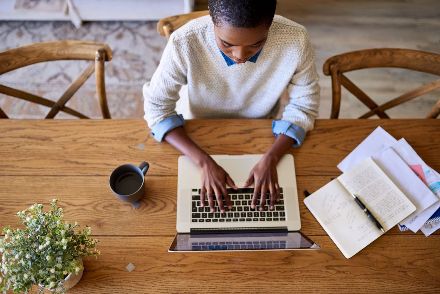 Focused young african american female entrepreneur working from her home