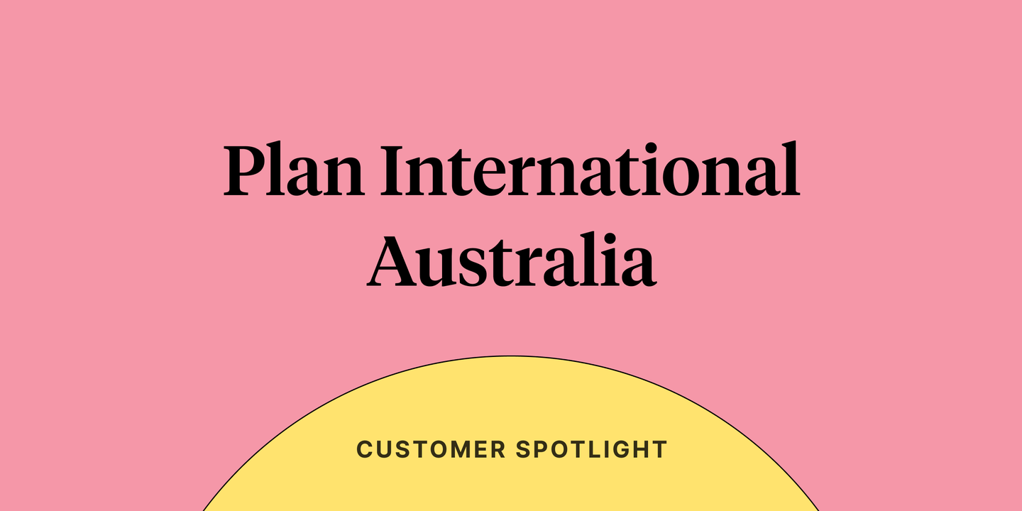 Text reading "Plan International Australia" on a light pink background