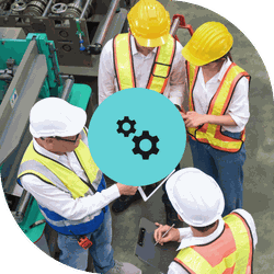 manufacturers in a warehouse wearing hard hats