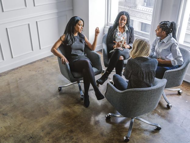 Professional businesswomen talking