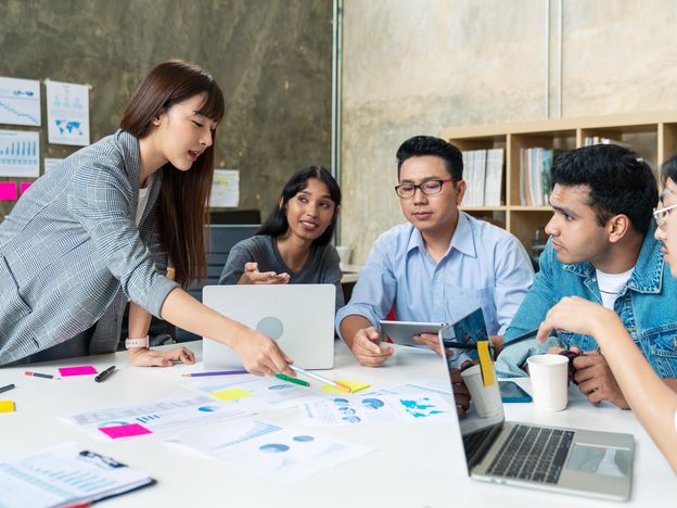 Candid of happy asian business people teamwork are brainstorming or discussion roadmap marketing leader woman is presentaion and planning strategy for new business business brainstorm concept