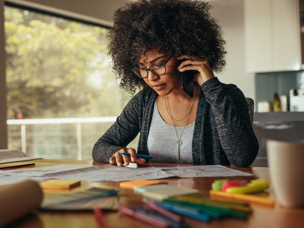 Female architect talking over phone