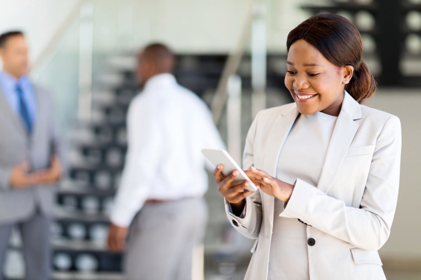 Young african american career woman using cell phone