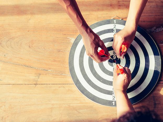 Meaningful target of business dart is an opportunity and dartboard is the target and goal business marketing as concept