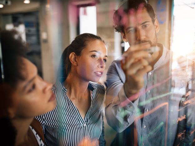Employees working through equation
