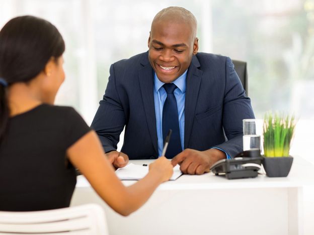 African woman signing employment contract