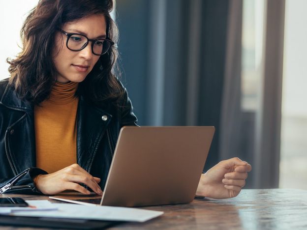 Asian woman working laptop at office