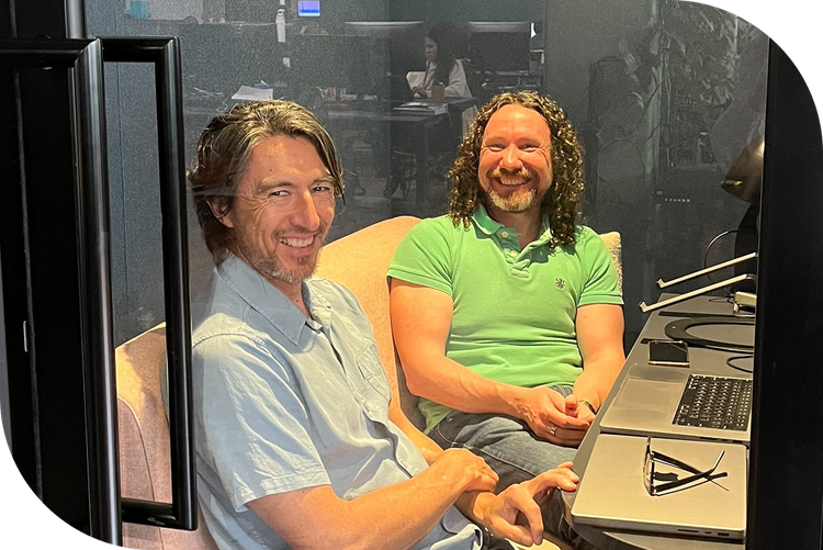 Culture Amp employees smiling from an office meeting room