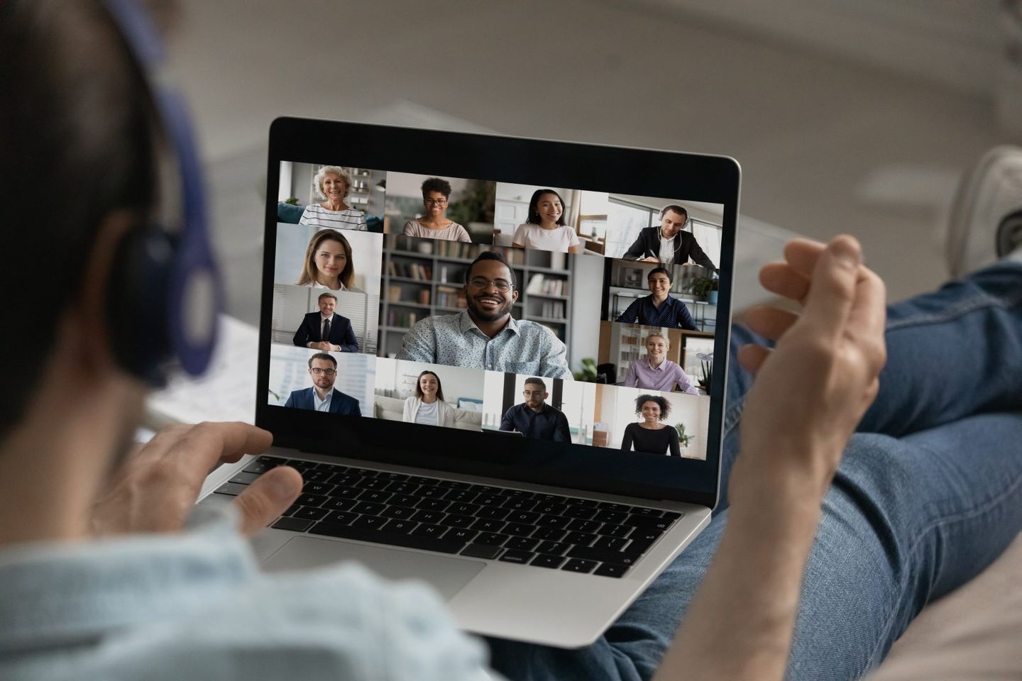 Male employee have group video call with colleagues